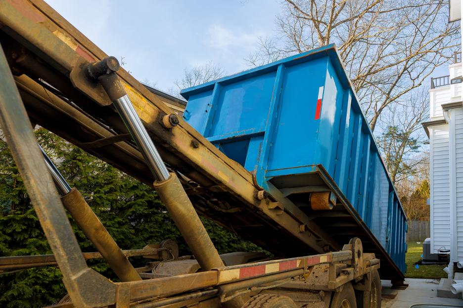 Dumpster rental being delivered at a house in Wauwatosa, Wisconsin